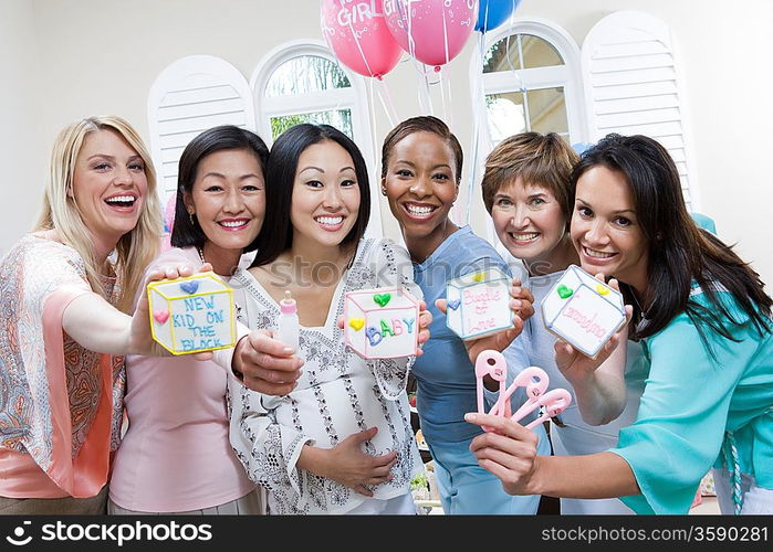 Pregnant Asian Woman with friends at a Baby Shower