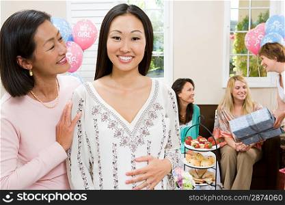 Pregnant Asian Woman with Mother at a Baby Shower