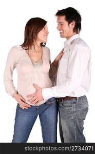 Pregnant couple embrace