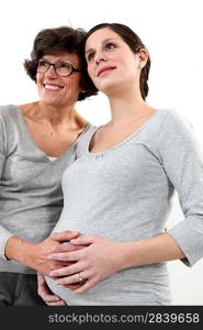 Pregnant daughter stood with mother