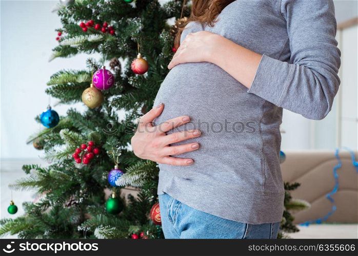Pregnant expectant mother during christmas