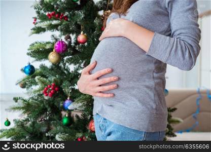Pregnant expectant mother during christmas