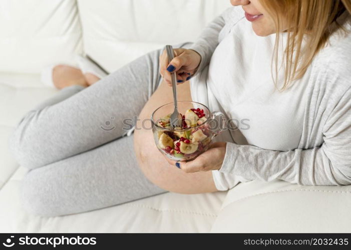 pregnant lady eating salad