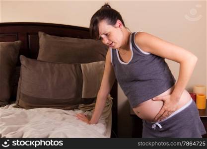 Pregnant lady in pain with a stomach cramp
