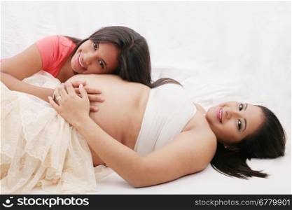 Pregnant mother with her daughter