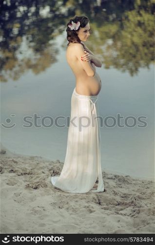 Pregnant nymph resting by the lakeside