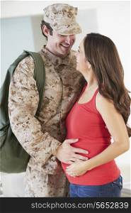 Pregnant Wife Greeting Military Mother Home On Leave