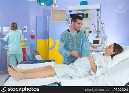 pregnant woman and her man in delivery room