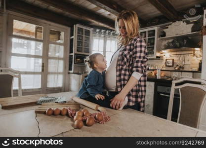 Pregnant woman and little daughter in the rustic kitchen preparing meal