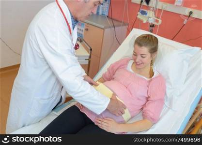 pregnant woman and male doctor