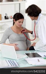 Pregnant woman at a doctor&rsquo;s surgery