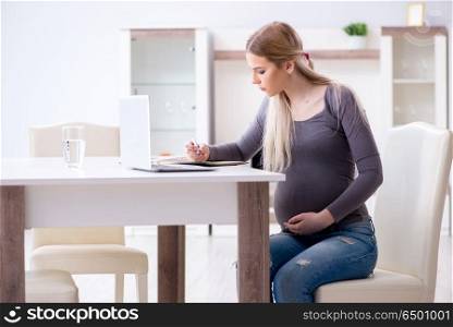Pregnant woman at home getting ready for childbirth
