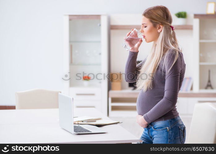 Pregnant woman at home getting ready for childbirth