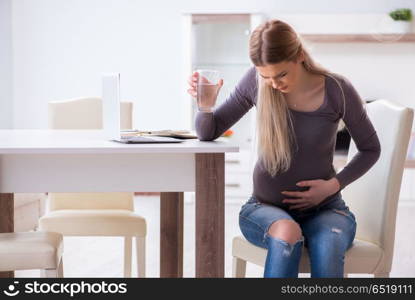 Pregnant woman at home getting ready for childbirth