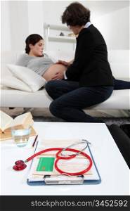 Pregnant woman being examined