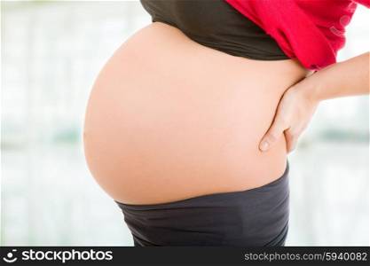 pregnant woman, closeup at the belly