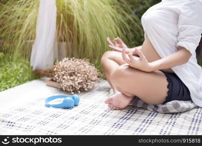 Pregnant woman do yoga at outdoor in nature background, Healthy Activity and Meditation concept