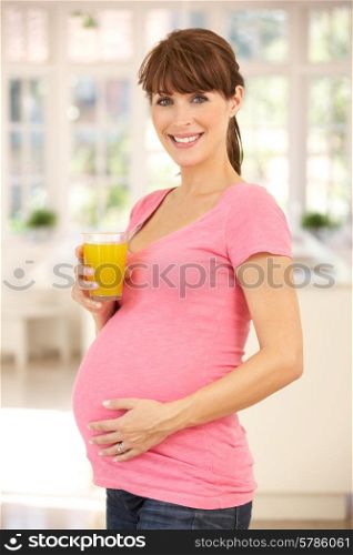 Pregnant woman drinking fruit juice