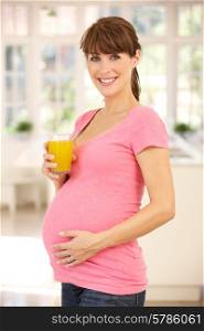 Pregnant woman drinking fruit juice