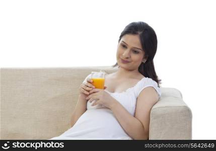 Pregnant woman drinking juice