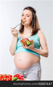 pregnant woman eating fork delicious vegetable salad