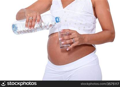 Pregnant Woman filling glass of water