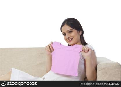 Pregnant woman holding a baby t-shirt