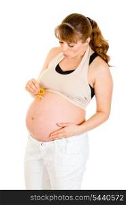 Pregnant woman holding baby dummy near belly isolated on white&#xA;