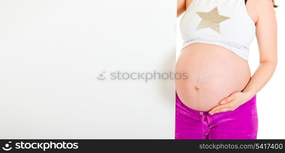 Pregnant woman holding blank billboard isolated on white. Close-up.&#xA;