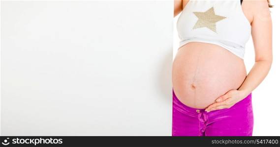Pregnant woman holding blank billboard isolated on white. Close-up.&#xA;