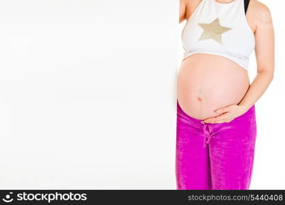 Pregnant woman holding blank billboard isolated on white. Close-up.&#xA;