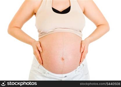 Pregnant woman holding her belly isolated on white. Close-up.&#xA;