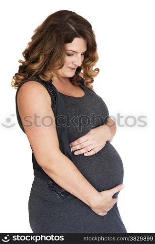 pregnant woman holding her hands on her belly