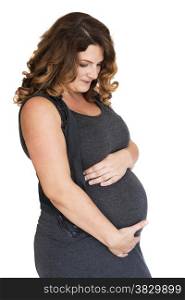pregnant woman holding her hands on her belly