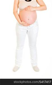 Pregnant woman holding her tummy isolated on white background. Close-up.&#xA;