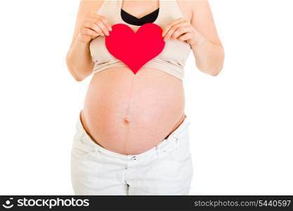 Pregnant woman holding paper heart in her hands isolated on white. Close-up.&#xA;