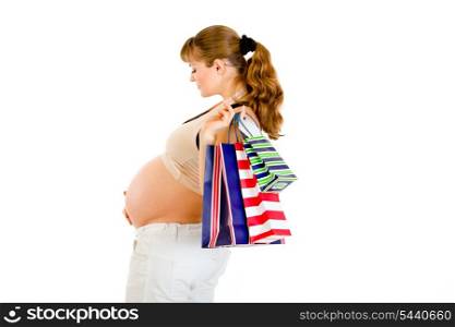 Pregnant woman holding shopping bags in hand isolated on white&#xA;