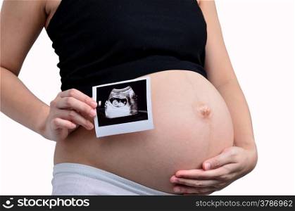 Pregnant woman holding ultrasound image isolated on white background