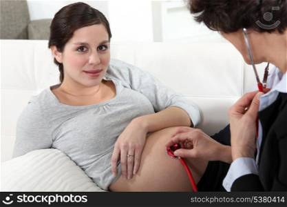 Pregnant woman in doctors appointment