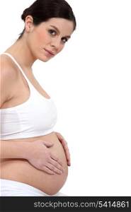 Pregnant woman in white lycra