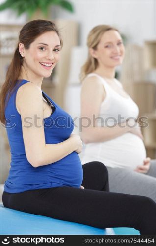 pregnant woman in yoga class