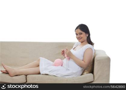 Pregnant woman knitting