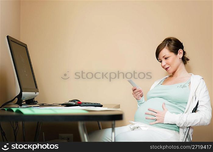 pregnant woman looking at scans