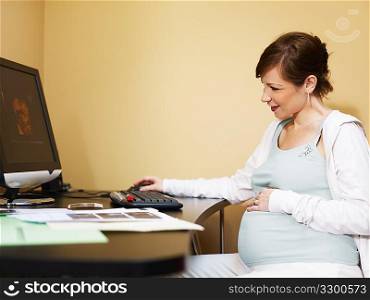pregnant woman looking at scans