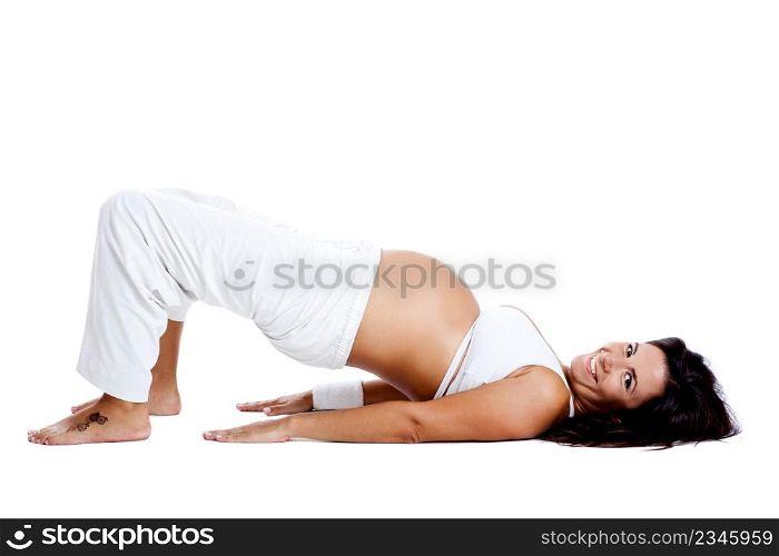 Pregnant woman making fitness exercises, isolated on white