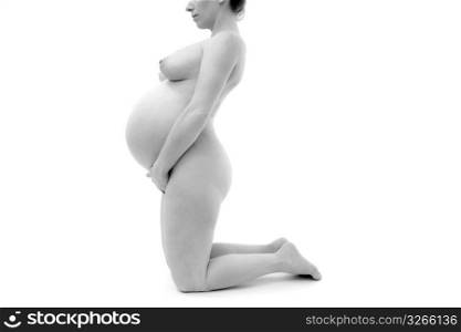 pregnant woman on knees nude profile studio white background