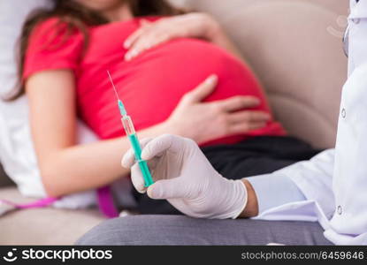 Pregnant woman patient visiting doctor for regular check-up