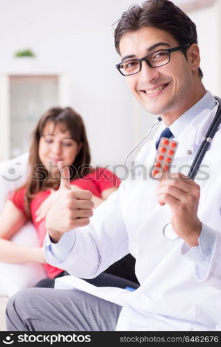 Pregnant woman patient visiting doctor for regular check-up