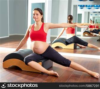 pregnant woman pilates side stretchs exercise with Wave corrector