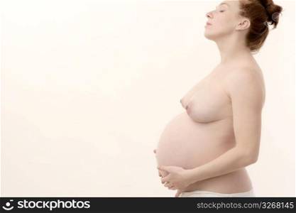 pregnant woman profile nude isolated on white background
